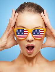 Image showing happy teenage girl in shades with american flag