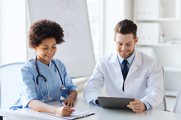 Image showing two happy doctors meeting at hospital office