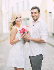 Image showing couple with flowers in the city