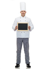 Image showing happy male chef cook holding blank menu board