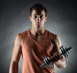 Image showing young man with dumbbell