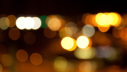 Image showing golden bright lights on dark night background