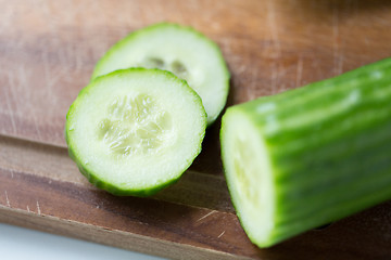 Image showing close up of cucumber on wooden cutting board