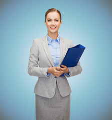Image showing smiling businesswoman holding folder