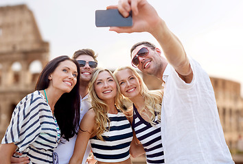 Image showing friends taking selfie with smartphone