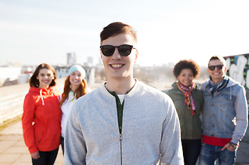 Image showing group of happy teenage friends on city street