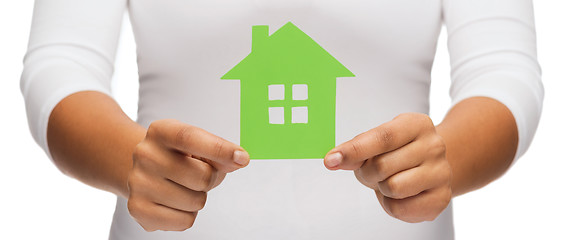 Image showing woman hands holding green house