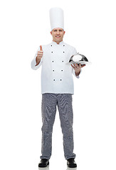 Image showing happy male chef cook with cloche showing thumbs up