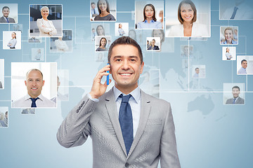 Image showing happy businessman calling on smartphone