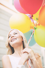 Image showing woman with colorful balloons