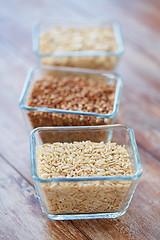 Image showing close up of grain in glass bowls on wooden table