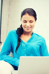 Image showing happy woman with laptop computer