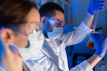 Image showing close up of scientists making test in lab