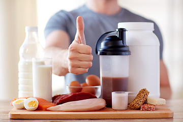 Image showing man with protein food showing thumbs up