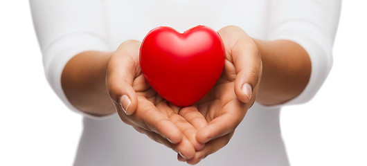 Image showing womans cupped hands showing red heart