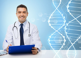 Image showing happy doctor with clipboard over blue background