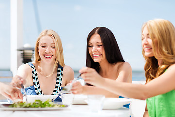 Image showing girls in cafe on the beach