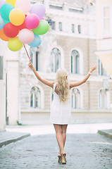 Image showing woman with colorful balloons