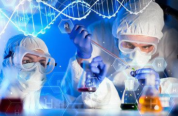 Image showing close up of scientists making test in lab