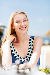 Image showing girl in cafe on the beach