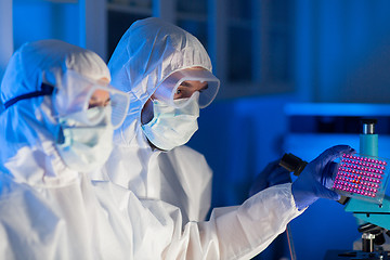 Image showing close up of scientists making test in chemical lab