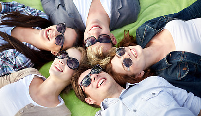 Image showing group of students or teenagers lying in circle