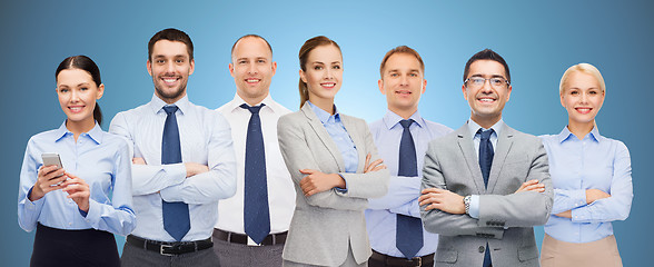 Image showing group of happy businesspeople with crossed arms