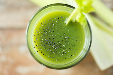 Image showing close up of fresh green juice glass and celery