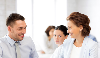 Image showing usiness colleagues talking in office