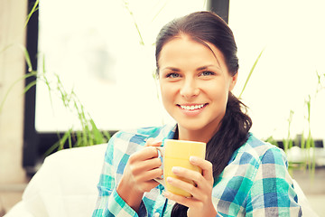 Image showing lovely housewife with mug