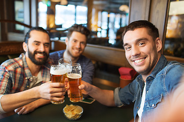 Image showing friends taking selfie and drinking beer at bar