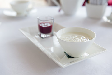 Image showing close up of yogurt and jam at restaurant