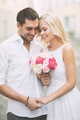 Image showing couple with flowers in the city