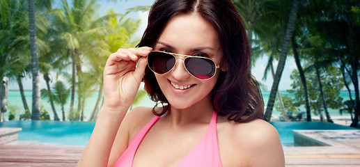 Image showing happy woman in sunglasses and swimsuit