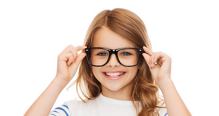 Image showing smiling cute little girl with black eyeglasses