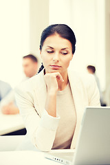 Image showing businesswoman with laptop computer at work