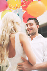 Image showing couple with colorful balloons