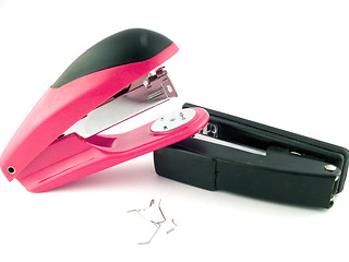 Image showing Red and black staplers on a white background. isolated