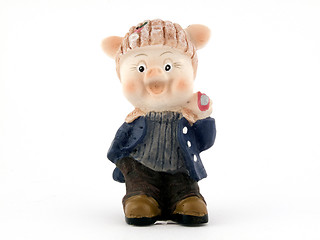 Image showing Souvenir - a toy a pig on a white background. isolated