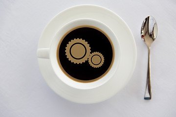 Image showing cup of coffee with cogwheel symbol and spoon