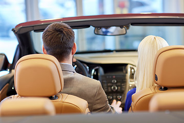 Image showing couple sitting in cabriolet car at auto show