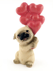 Image showing Souvenir - a toy a dog on a white background. isolated 2