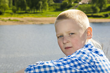 Image showing Portrait of boy on summer river background