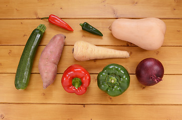 Image showing Selection of raw vegetables on a wooden table
