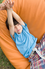 Image showing boy stretching arms