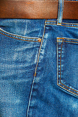 Image showing jeans with a brown leather belt