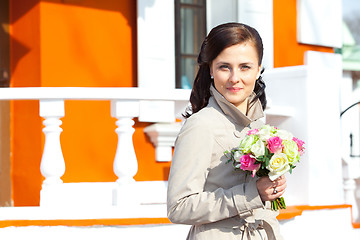 Image showing beautiful young woman with a wedding bouquet