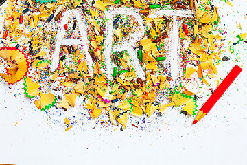 Image showing ART word on the background of colored pencil shavings