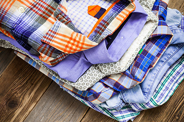 Image showing summer bright shirts in a pile