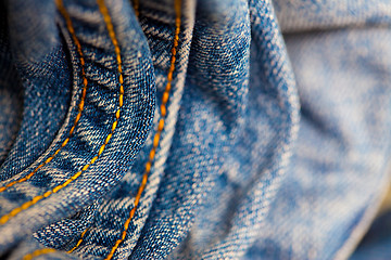 Image showing blue Jeans with yellow stitching thread